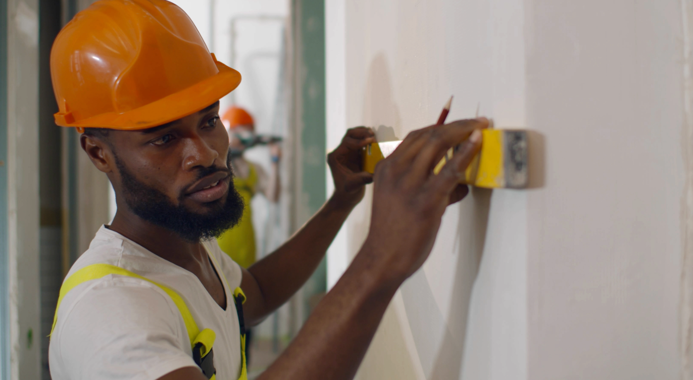 Ceiling structure showing furring strips installed on concrete in a condominium unit.
