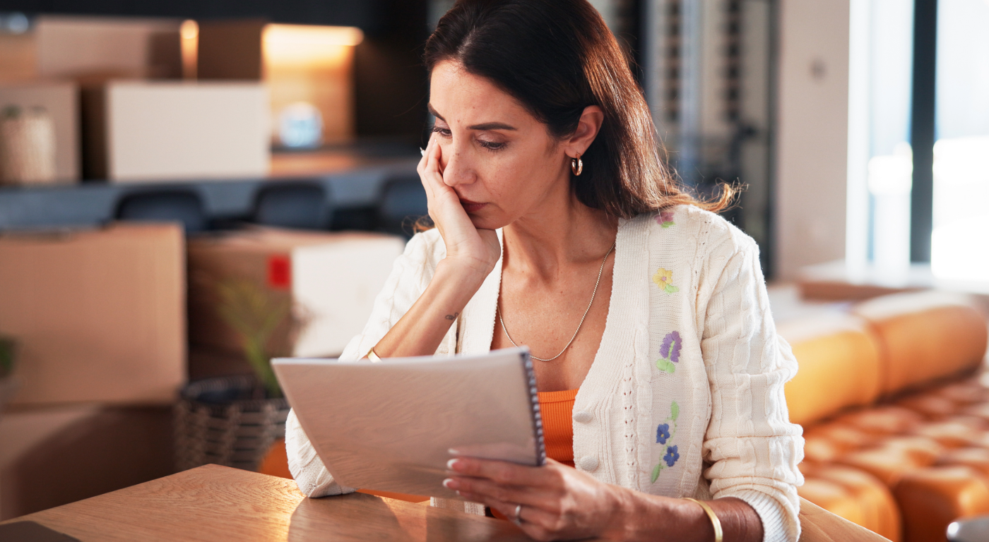 Frustrated condo owner reviewing documents